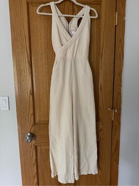 Sleeveless Cream Wide-Leg Cross-Back Jumpsuit